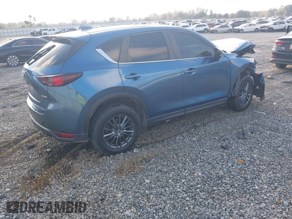 2020 Mazda CX-5 Touring with VIN JM3KFACM0L0775020, listed as a IAAI auction lot 40876970 with 96,424 mi miles. Bid and sale history available at carsss.com. Image 4.