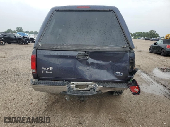2000 Ford F-150 XL with VIN 1FTRX17L7YNC24292, listed as a Copart auction lot 58852925 with 213,318 mi miles and Salvage title. Bid and sale history available at DreamBid. Image 6.