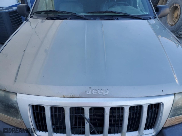 1999 Jeep Grand Cherokee Laredo with VIN 1J4GW58N9XC730311, listed as a Copart auction lot 77774544 with 0 mi miles and Salvage Title. Bid and sale history available at carsss.com. Image 12.