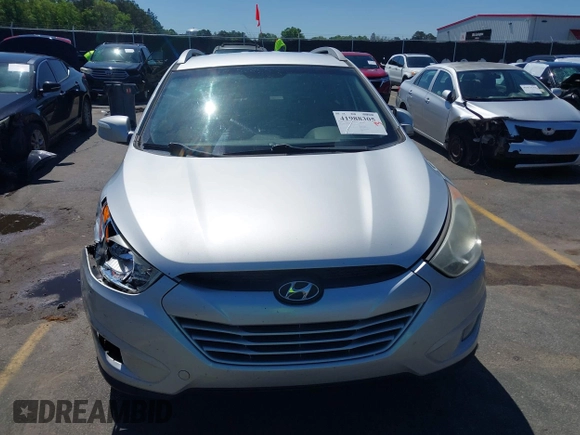 2013 Hyundai Tucson GLS with VIN KM8JU3AC3DU551018, listed as a IAAI auction lot 41988305 with 214,728 mi miles. Bid and sale history available at carsss.com. Image 12.
