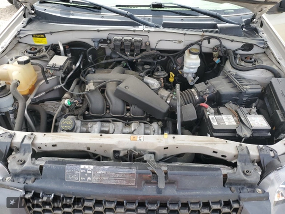 2005 Ford Escape XLT with VIN 1FMYU03165KC03784, listed as a Copart auction lot 64299225 with 185,033 mi miles and Salvage title. Bid and sale history available at DreamBid. Image 12.