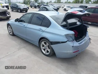 2013 BMW 3 Series 320i with VIN WBA3B1C54DK128284, listed as a IAAI auction lot 40315808 with 136,104 mi miles. Bid and sale history available at carsss.com. Image 3.