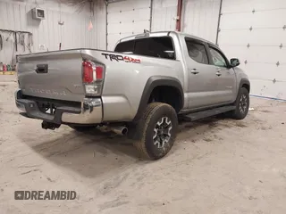 2023 Toyota Tacoma SR z VIN 3TMCZ5AN4PM597509, wystawiony jako IAAI lot #42020023 z przebiegiem 36 941 mil mil oraz . Historia ofert i sprzedaży dostępna na DreamBid. Obrazek 4.