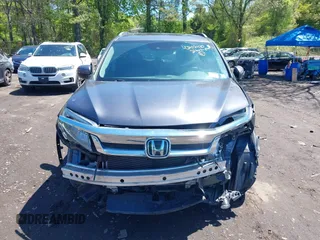 2021 Honda Pilot Touring 8-Passenger z VIN 5FNYF6H9XMB059037, wystawiony jako IAAI lot #42202410 z przebiegiem 49 267 mil mil oraz . Historia ofert i sprzedaży dostępna na DreamBid. Obrazek 12.