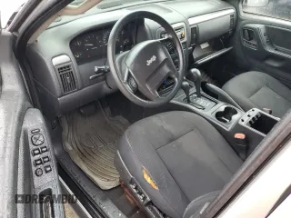 2004 Jeep Grand Cherokee Laredo z VIN 1J4GW48S74C288625, wystawiony jako Copart lot #61290805 z przebiegiem 194 615 mil mil oraz Czysty tytuł • Clean title. Historia ofert i sprzedaży dostępna na DreamBid. Obrazek 8.