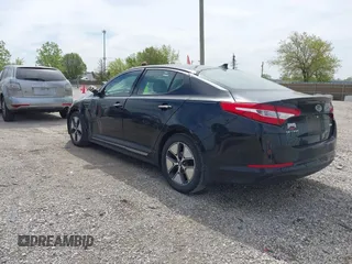 2012 Kia Optima Hybrid with VIN KNAGM4AD5C5017635, listed as a IAAI auction lot 42214181 with 159,599 mi miles. Bid and sale history available at carsss.com. Image 3.