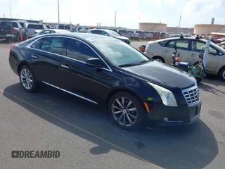 2013 Cadillac XTS Livery z VIN 2G61W5S36D9124537, wystawiony jako IAAI lot #41670964 z przebiegiem 78 819 mil mil oraz . Historia ofert i sprzedaży dostępna na DreamBid. Obrazek 1.