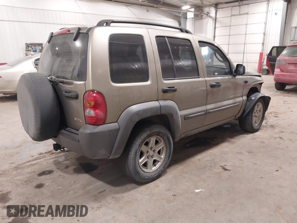 2003 Jeep Liberty Sport with VIN 1J4GL48K83W652993, listed as a IAAI auction lot 41086140 with 115,177 mi miles and . Bid and sale history available at DreamBid. Image 4.