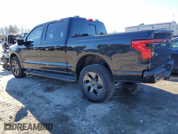 2023 Ford F-150 Lightning Pro with VIN 1FTVW1EL8PWG53681, listed as a Copart auction lot 42681505 with 7,570 mi miles and Salvage Title. Bid and sale history available at DreamBid. Image 2.