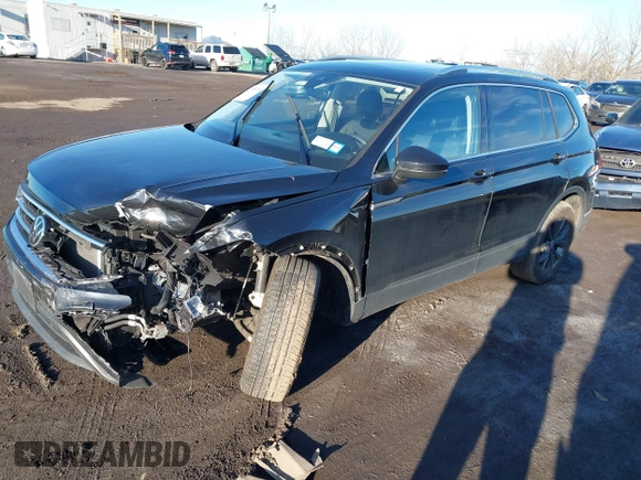 2023 Volkswagen Tiguan SE with VIN 3VVMB7AX8PM032557, listed as a IAAI auction lot 41585975 with 28,706 mi miles and . Bid and sale history available at DreamBid. Image 2.