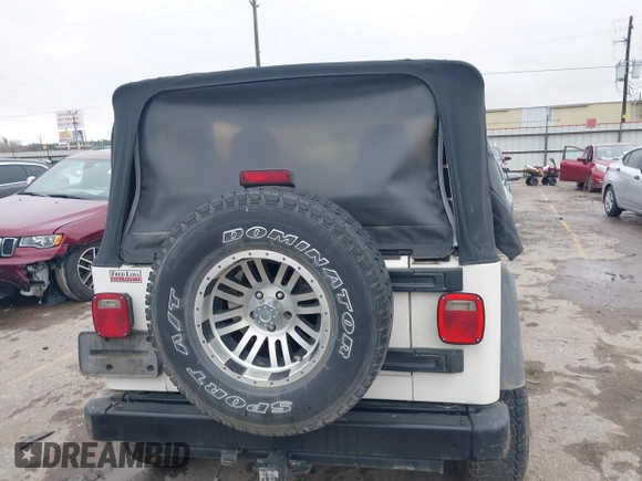 2005 Jeep Wrangler Sport with VIN 1J4FA49S25P320240, listed as a IAAI auction lot 41433371 with 144,552 mi miles. Bid and sale history available at carsss.com. Image 16.