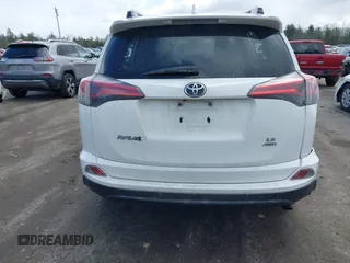 2018 Toyota RAV4 LE with VIN JTMBFREV5JJ738405, listed as a IAAI auction lot 41956145 with 100,593 mi miles and . Bid and sale history available at DreamBid. Image 17.