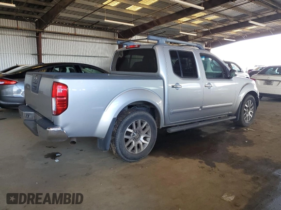 2009 Nissan Frontier SE with VIN 1N6AD07U69C403815, listed as a Copart auction lot 49161015 with 181,843 mi miles and Salvage title. Bid and sale history available at DreamBid. Image 3.