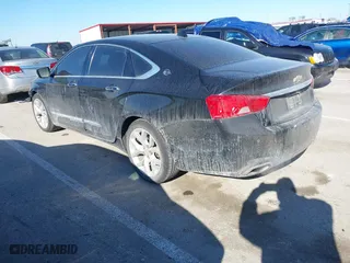 2014 Chevrolet Impala LTZ with VIN 2G1155S31E9105694, listed as a IAAI auction lot 41414595 with 128,828 mi miles. Bid and sale history available at carsss.com. Image 3.