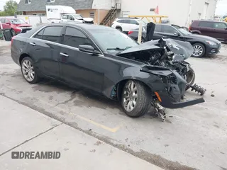 2014 Cadillac CTS Premium AWD with VIN 1G6AZ5S32E0127986, listed as a IAAI auction lot 42303700 with 89,806 mi miles and . Bid and sale history available at DreamBid. Image 1.