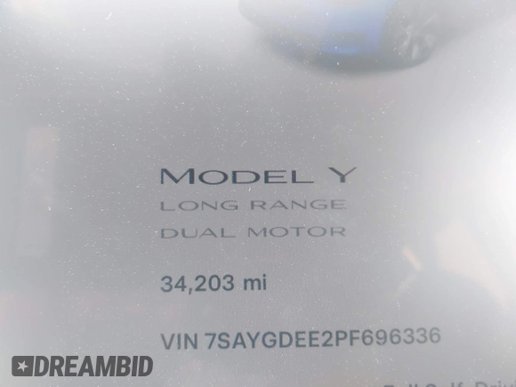2023 Tesla Model Y Long Range with VIN 7SAYGDEE2PF696336, listed as a IAAI auction lot 41894686 with 34,203 mi miles. Bid and sale history available at carsss.com. Image 7.