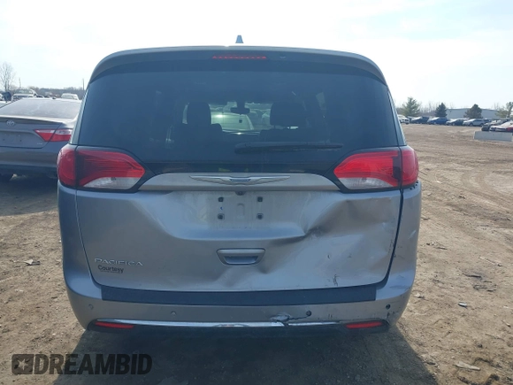 2018 Chrysler Pacifica Touring L with VIN 2C4RC1BG7JR101736, listed as a IAAI auction lot 41776231 with 90,487 mi miles and . Bid and sale history available at DreamBid. Image 16.