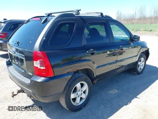 2010 Kia Sportage LX with VIN KNDKGCA34A7669279, listed as a IAAI auction lot 42132770 with 142,828 mi miles and . Bid and sale history available at carsss.com. Image 4.