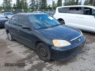 2002 Honda Civic LX with VIN 1HGES16552L060982, listed as a IAAI auction lot 42141884 with 202,659 mi miles and . Bid and sale history available at carsss.com. Image 1.
