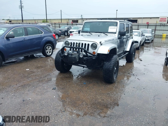 2012 Jeep Wrangler Unlimited Call of Duty MW3 with VIN 1C4BJWFG7CL281844, listed as a IAAI auction lot 42494946 with 93,669 mi miles and . Bid and sale history available at DreamBid. Image 2.