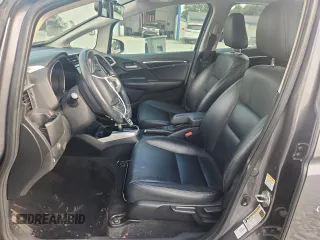 2015 Honda Fit EX-L with VIN 3HGGK5H87FM708737, listed as a Copart auction lot 64310745 with 90,446 mi miles and Salvage title. Bid and sale history available at DreamBid. Image 7.