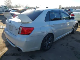 2013 Subaru Impreza Sedan WRX WRX STI Limited with VIN JF1GV8J69DL030013, listed as a IAAI auction lot 41626985 with 105,937 mi miles. Bid and sale history available at carsss.com. Image 4.