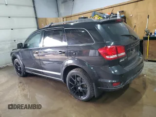 2013 Dodge Journey Crew with VIN 3C4PDCCG4DT693869, listed as a Copart auction lot 63666684 with 134,424 mi miles and Salvage title. Bid and sale history available at DreamBid. Image 2.