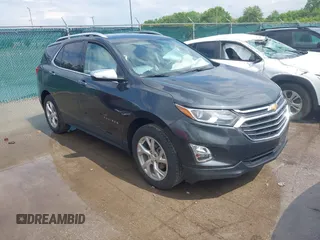2021 Chevrolet Equinox Premier with VIN 2GNAXNEVXM6140093, listed as a IAAI auction lot 42627819 with 36,271 mi miles and . Bid and sale history available at DreamBid. Image 1.