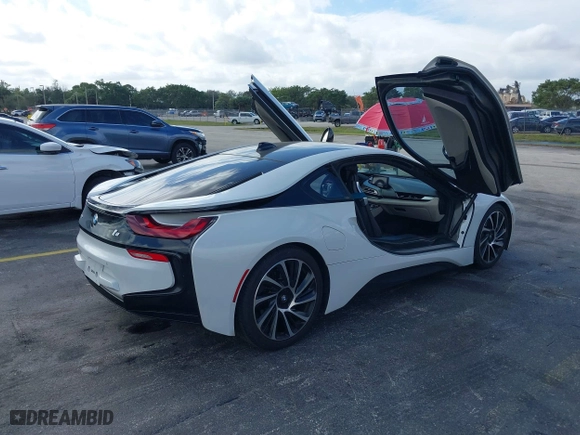 2015 BMW i8 with VIN WBY2Z2C51FV392661, listed as a IAAI auction lot 38409147 with 79,082 mi miles. Bid and sale history available at carsss.com. Image 4.