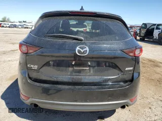 2017 Mazda CX-5 Touring z VIN JM3KFBCL4H0184922, wystawiony jako Copart lot #50166195 z przebiegiem 86 270 mil mil oraz Szkoda całkowita • Salvage title. Historia ofert i sprzedaży dostępna na DreamBid. Obrazek 6.