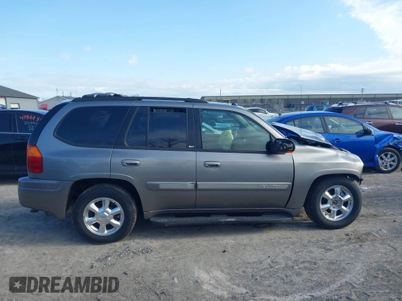 2005 GMC Envoy SLE with VIN 1GKDT13S852362380, listed as a IAAI auction lot 42031727 with 76,711 mi miles. Bid and sale history available at carsss.com. Image 14.