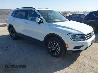 2021 Volkswagen Tiguan SE with VIN 3VV3B7AX9MM051920, listed as a IAAI auction lot 41826721 with 127,699 mi miles and . Bid and sale history available at DreamBid. Image 1.
