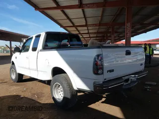 1999 Ford F-150 XL with VIN 2FTRX18L9XCA21004, listed as a IAAI auction lot 41616300 with 186,620 mi miles. Bid and sale history available at carsss.com. Image 3.