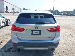 2018 BMW X1 xDrive28i with VIN WBXHT3C39J5L27926, listed as a IAAI auction lot 42582330 with 101,197 mi miles and . Bid and sale history available at DreamBid. Image 16.