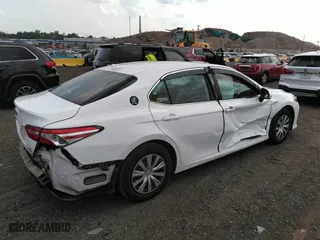 2020 Toyota Camry Hybrid LE with VIN 4T1C31AK2LU518579, listed as a IAAI auction lot 39981154 with 115,005 mi miles. Bid and sale history available at carsss.com. Image 4.