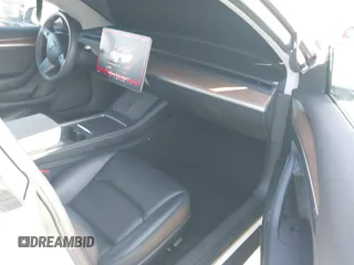 2023 Tesla Model 3 with VIN 5YJ3E1EA0PF503352, listed as a IAAI auction lot 41718658 with 28,426 mi miles and . Bid and sale history available at DreamBid. Image 5.