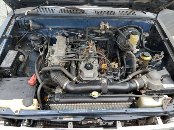 1994 Toyota Pickup DX z VIN 4TARN01P5RZ232120, wystawiony jako Copart lot #44245255 z przebiegiem 123 342 mil mil oraz Czysty tytuł • Clean title. Historia ofert i sprzedaży dostępna na DreamBid. Obrazek 11.