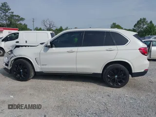2016 BMW X5 xDrive35i z VIN 5UXKR0C55G0P32557, wystawiony jako IAAI lot #42235246 z przebiegiem 104 947 mil mil oraz . Historia ofert i sprzedaży dostępna na DreamBid. Obrazek 14.