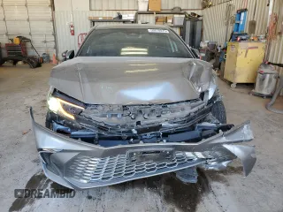 2025 Toyota Camry LE with VIN 4T1DAACKXSU556793, listed as a Copart auction lot 50574875 with 5,908 mi miles and Salvage Title. Bid and sale history available at carsss.com. Image 5.