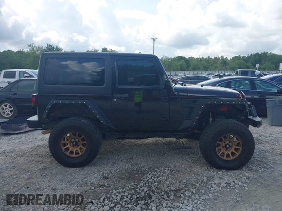 2012 Jeep Wrangler Sport z VIN 1C4AJWAG2CL286680, wystawiony jako IAAI lot #42434411 z przebiegiem 97 142 mil mil oraz . Historia ofert i sprzedaży dostępna na DreamBid. Obrazek 13.