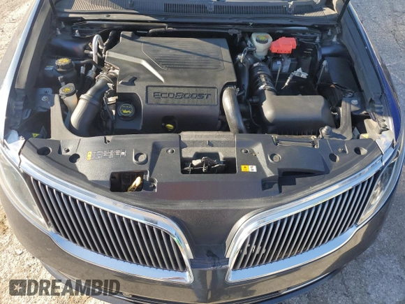 2014 Lincoln MKS EcoBoost z VIN 1LNHL9FT8EG607807, wystawiony jako Copart lot #57755915 z przebiegiem 203 316 mil mil oraz Szkoda całkowita • Salvage title. Historia ofert i sprzedaży dostępna na DreamBid. Obrazek 11.