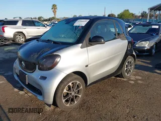 2016 Smart fortwo Passion with VIN WMEFJ5DA4GK068289, listed as a IAAI auction lot 41966659 with 155,009 mi miles and . Bid and sale history available at DreamBid. Image 2.