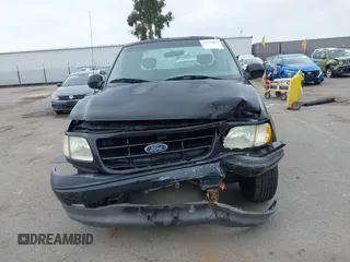 2002 Ford F-150 XL с VIN 1FTRX17242NB23323, выставлен на аукционе IAAI как лот 42363484 с пробегом Не указан миль и . История ставок и продаж доступна на DreamBid. Изображение 12.