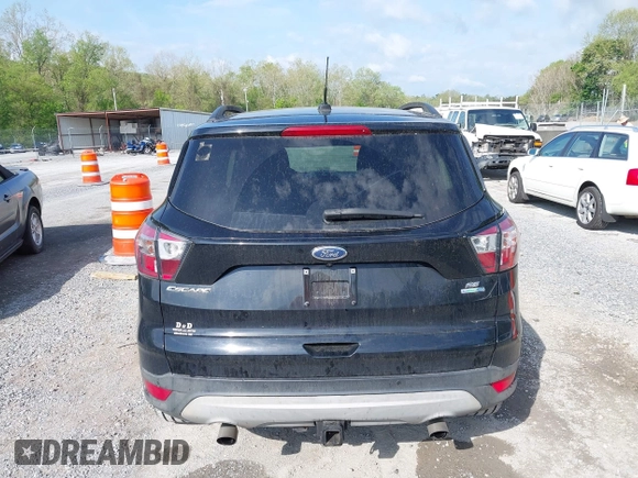 2017 Ford Escape SE with VIN 1FMCU9G91HUB56073, listed as a IAAI auction lot 42130463 with 94,275 mi miles and . Bid and sale history available at carsss.com. Image 16.