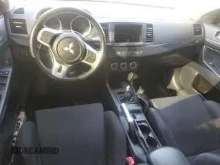 2014 Mitsubishi Lancer Evolution GSR z VIN JA32W8FV5EU023703, wystawiony jako Copart lot #72744504 z przebiegiem Nie podano mil oraz Szkody całkowita. Historia ofert i sprzedaży dostępna na DreamBid. Obrazek 8.