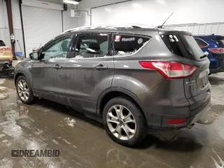 2015 Ford Escape Titanium with VIN 1FMCU9JX0FUA03009, listed as a Copart auction lot 50948755 with 133,748 mi miles and Salvage Title. Bid and sale history available at DreamBid. Image 2.