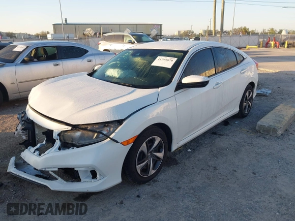 2019 Honda Civic LX with VIN 19XFC2F61KE014007, listed as a IAAI auction lot 41795070 with 64,259 mi miles and . Bid and sale history available at DreamBid. Image 17.