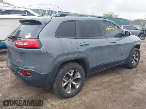 2014 Jeep Cherokee Trailhawk with VIN 1C4PJMBB5EW156315, listed as a IAAI auction lot 42426229 with 154,019 mi miles and . Bid and sale history available at DreamBid. Image 4.
