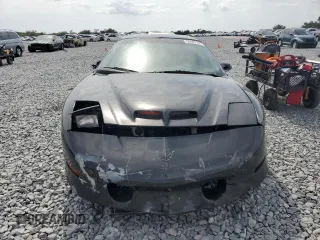 1995 Pontiac Firebird Trans Am z VIN 2G2FV22P8S2251923, wystawiony jako Copart lot #54007135 z przebiegiem 35 218 mil mil oraz Szkody całkowita. Historia ofert i sprzedaży dostępna na DreamBid. Obrazek 5.