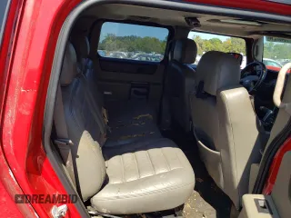 2004 Hummer H2 with VIN 5GRGN23U04H116668, listed as a Copart auction lot 70402334 with 0 mi miles and Salvage Title. Bid and sale history available at carsss.com. Image 11.
